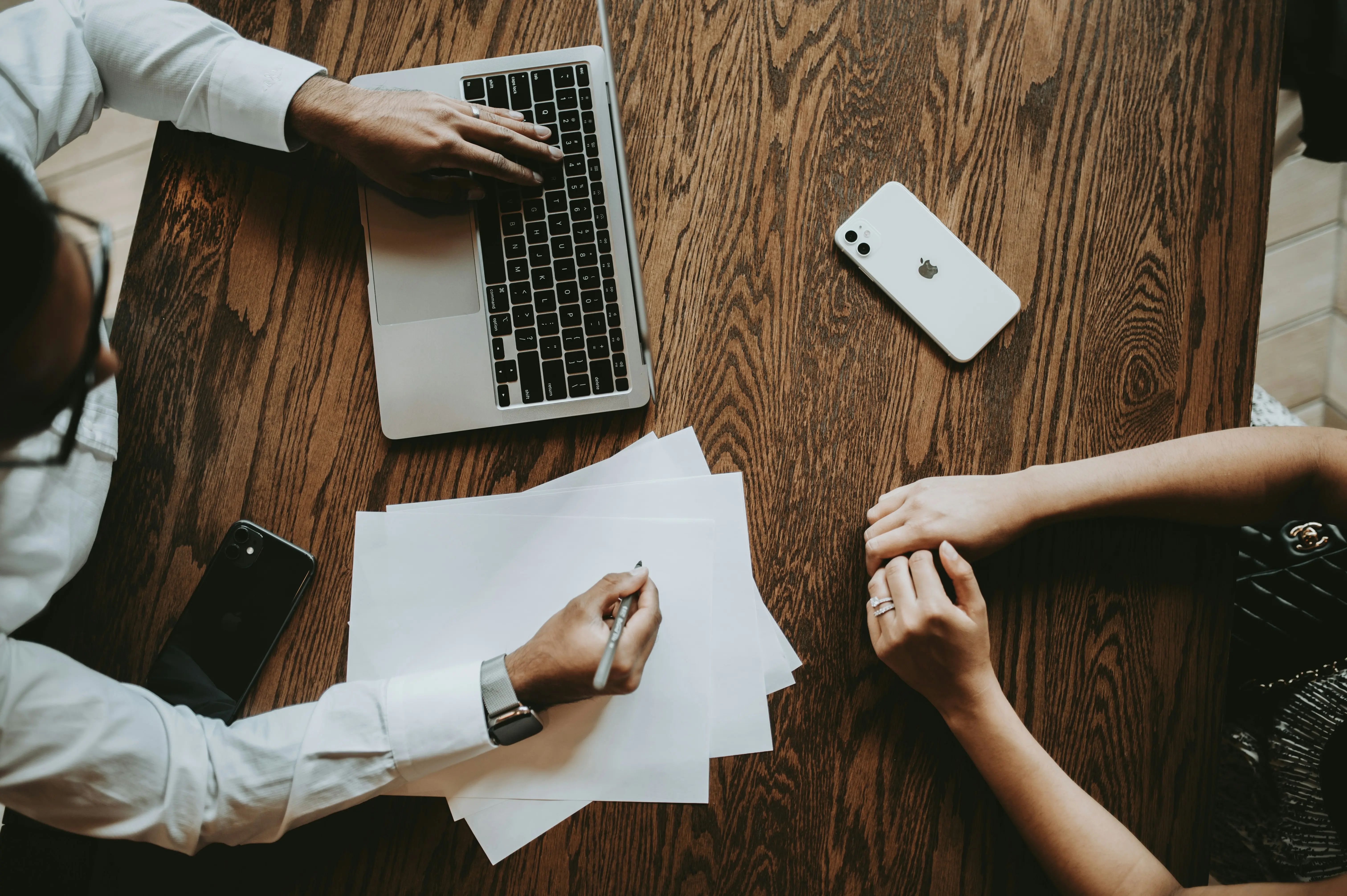 Two professionals collaborating at a desk